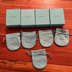 Four Tiffany and Co small boxes with 5 dust bags